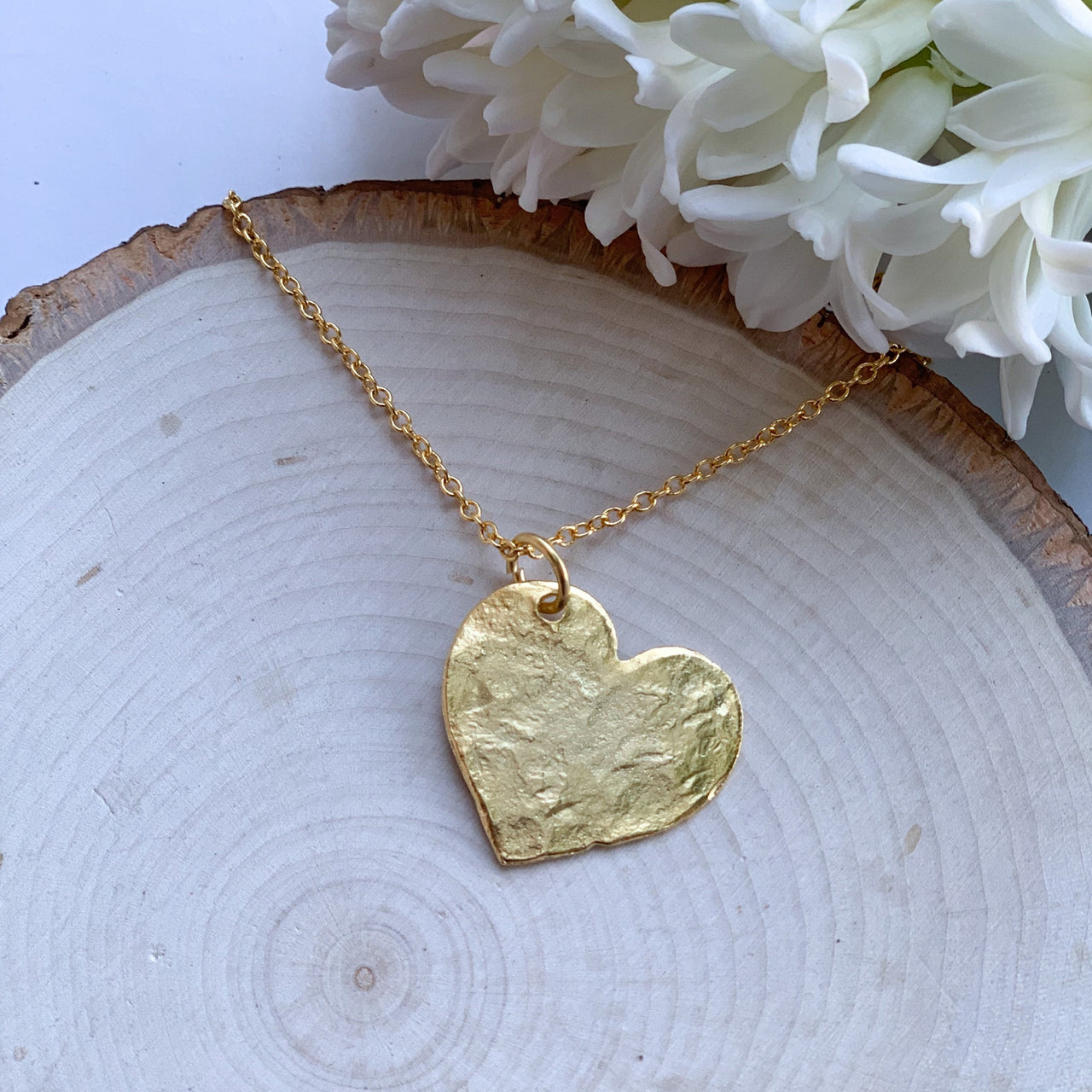 The Jewel Mama. Heart necklace. Hammered Heart Necklace. The Yoga Collection. Yoga. buy. Shop. Handmade.