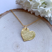 The Jewel Mama. Heart necklace. Hammered Heart Necklace. The Yoga Collection. Yoga. buy. Shop. Handmade.